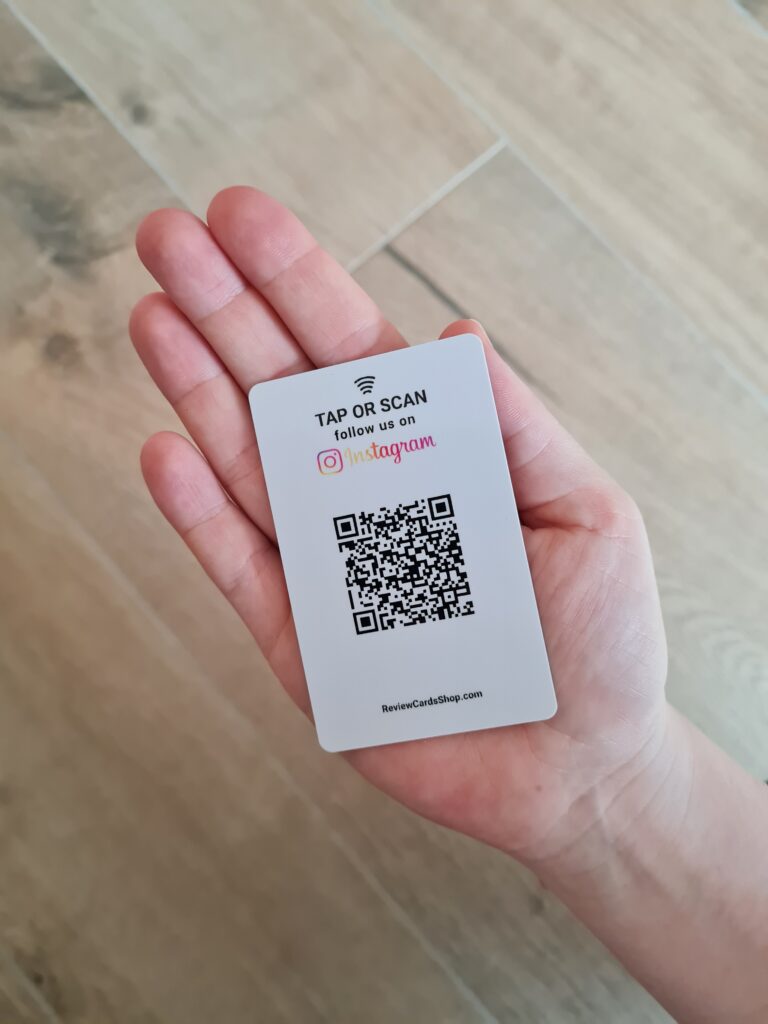 instagram follow us card with nfc and qr in hand