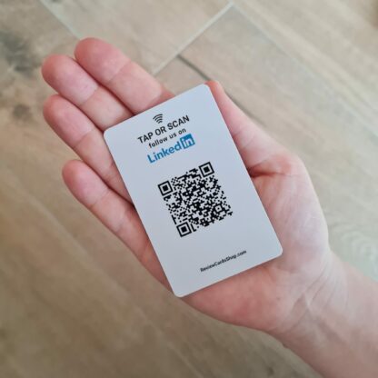 linkedin follow us card with nfc and qr in hand