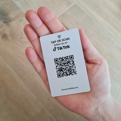 tiktok follow us card with nfc and qr in hand