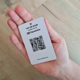 tripadvisor review card with nfc and qr in hand